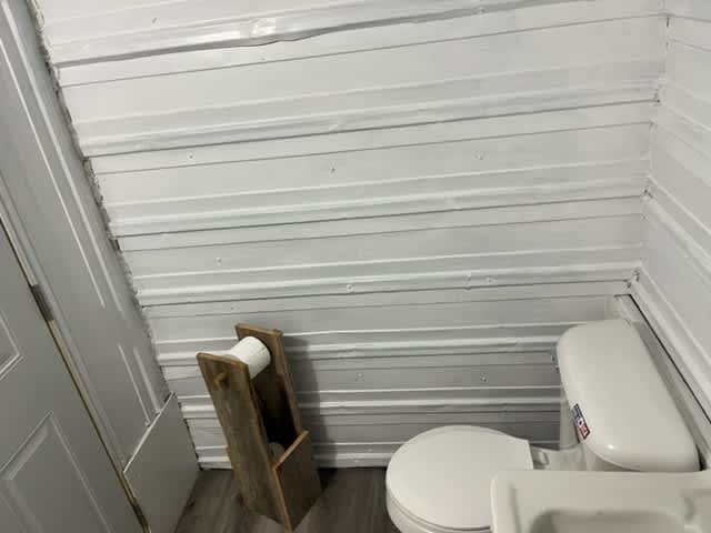 flushing toilet in bath house