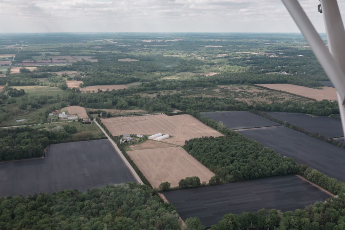 Aerial photograph of the property. The site sits on 49 acres of land with the camping spots in the forested area. 