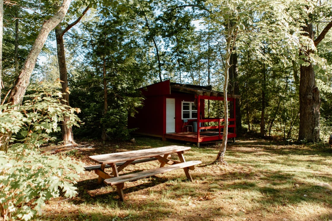 The small cabin and picnic table