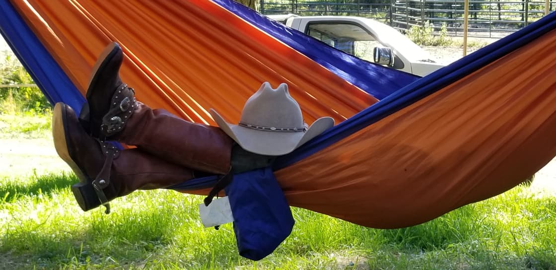 Even cowboys enjoy some R & R in the hammock.