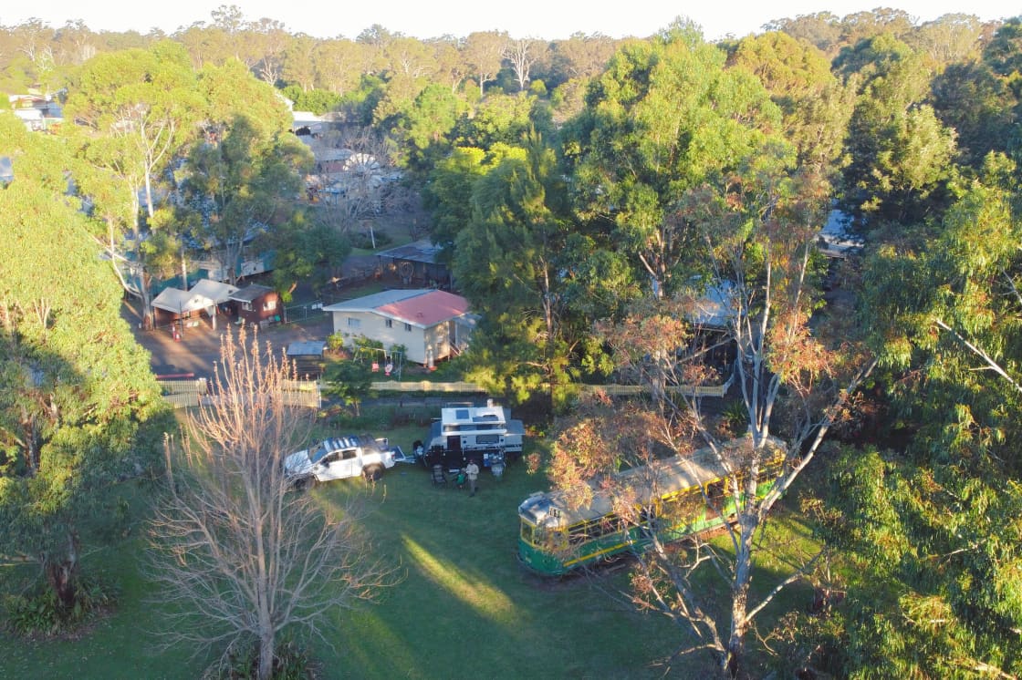 The campsite is leafy with manicured lawns and gardens.