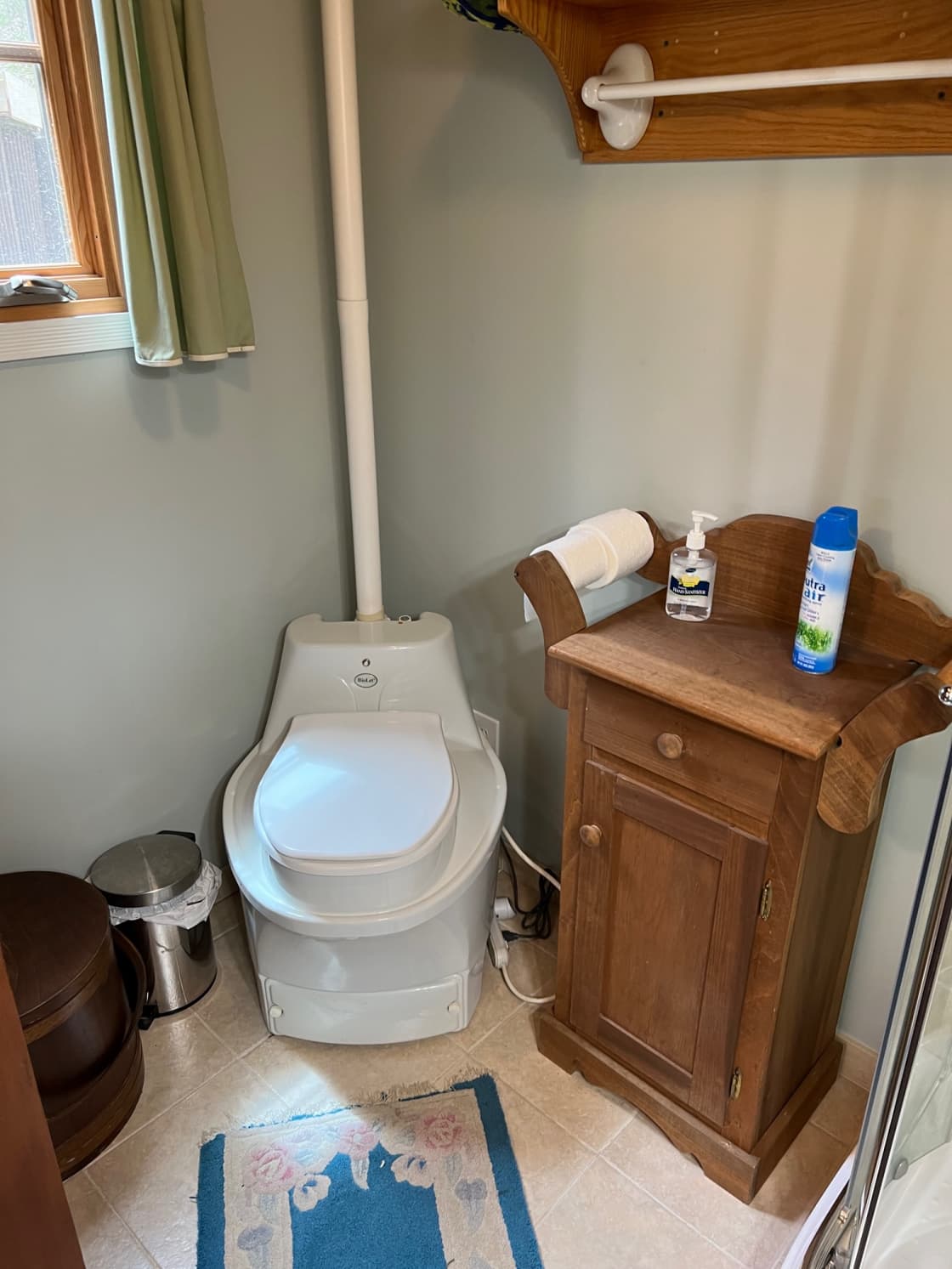 Bathroom showing composting toilet.