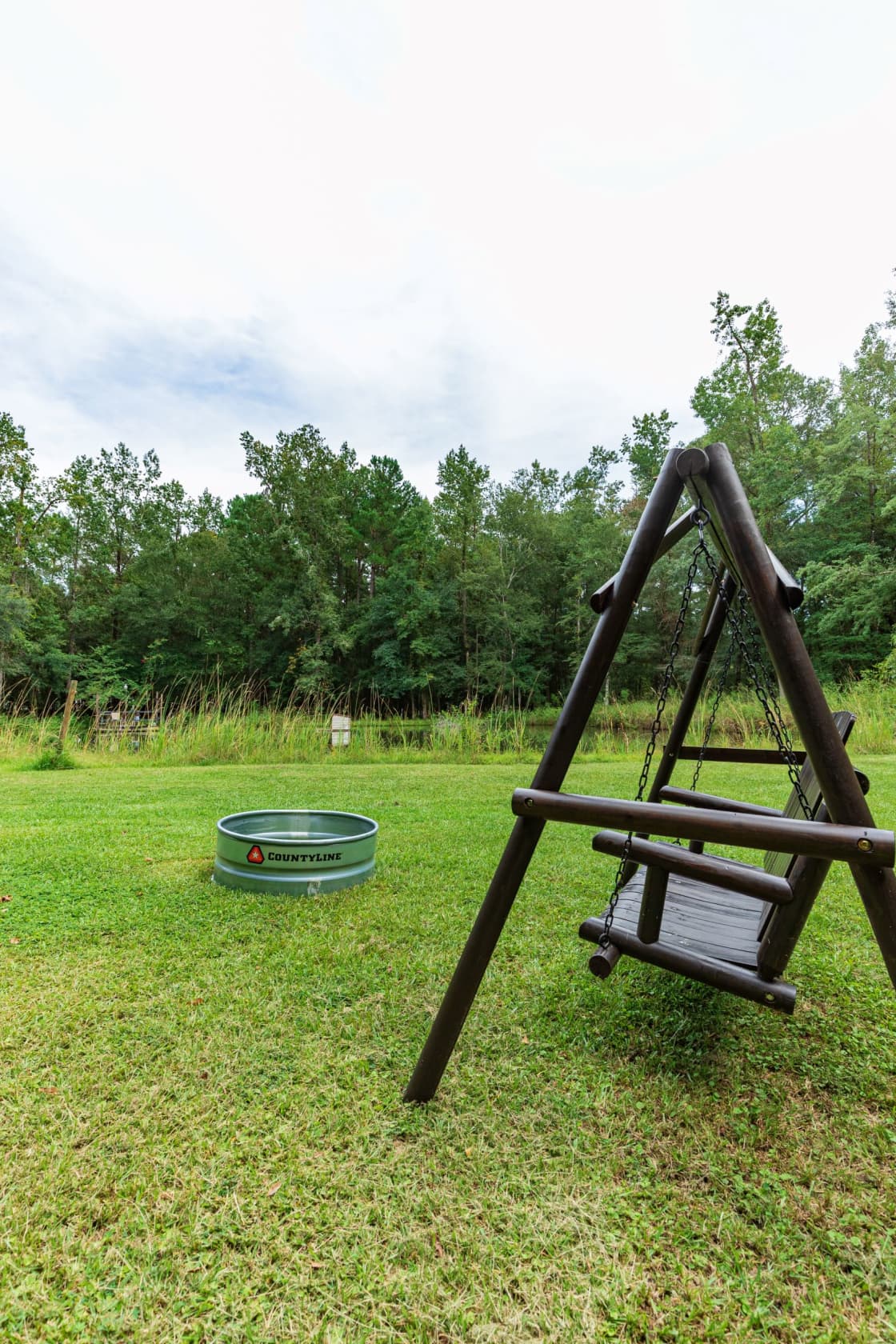 Site 2 - Includes a swing, picnic table and fire pit. 