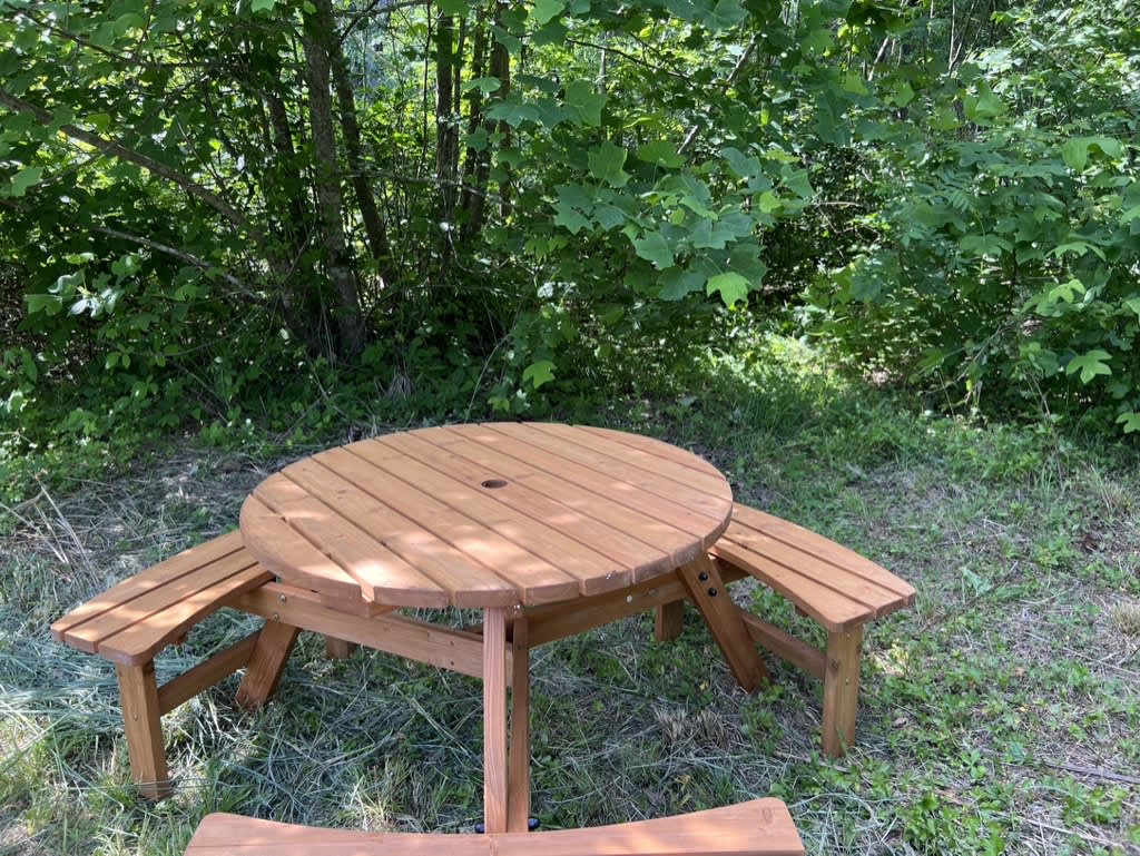 Here's a nice little table for your use. Put it wherever you like on your campsite. (This photo is taken at the Mountain Hideaway site.)