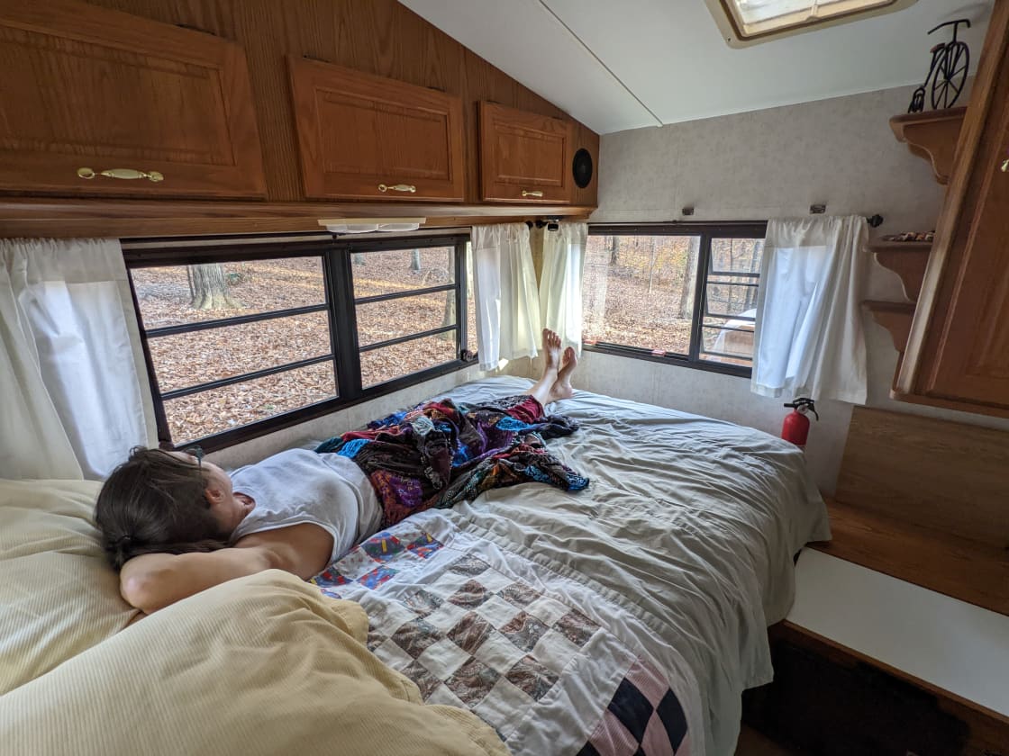 A regular full sized bed in the bedroom. The dining table also converts to a bed (camper sized twin).