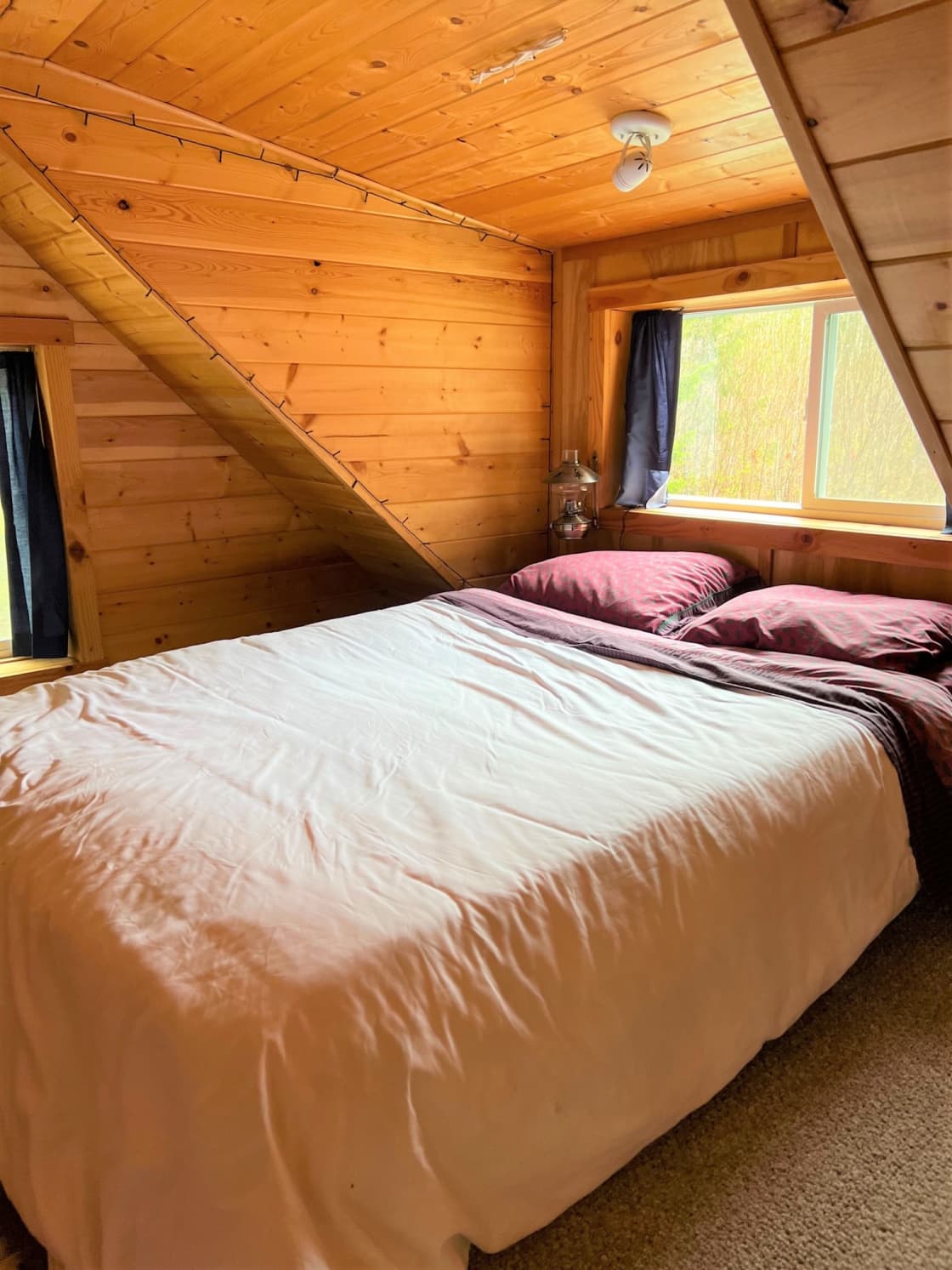 Sleeping loft with full-sized (double) futon bed
