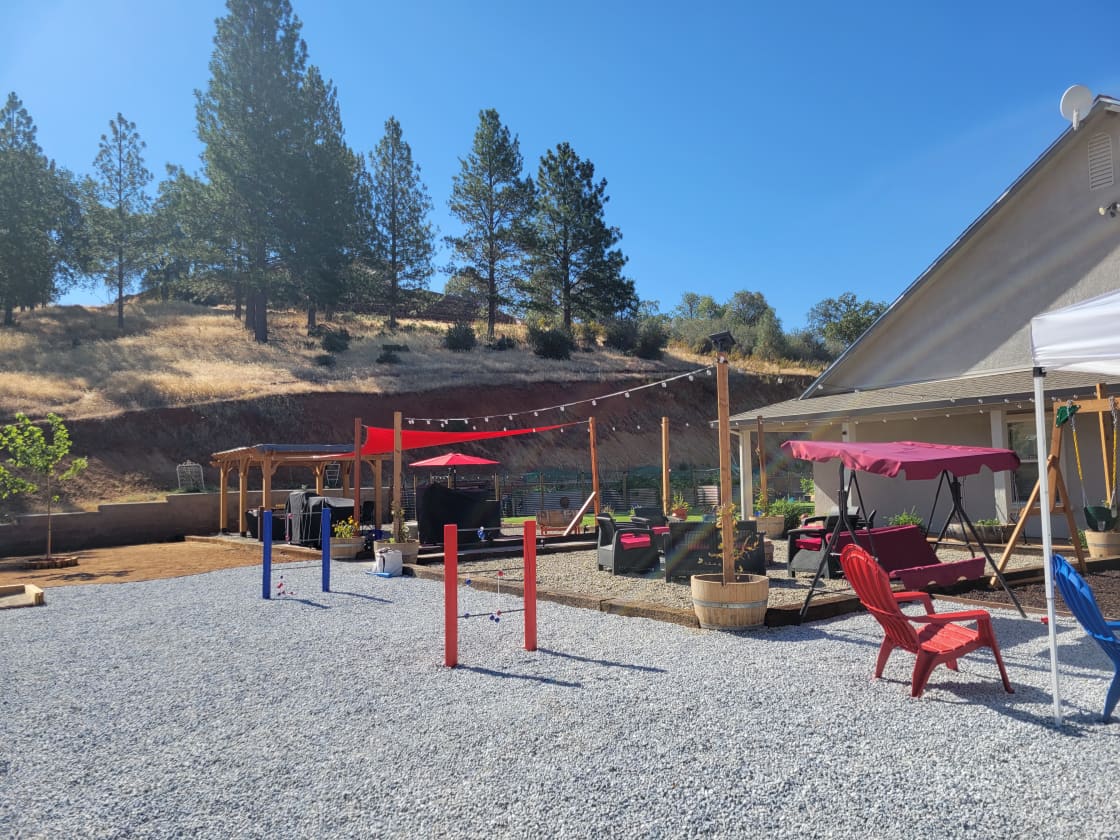 Outdoor gaming area with plenty of seating and fun for the whole family!