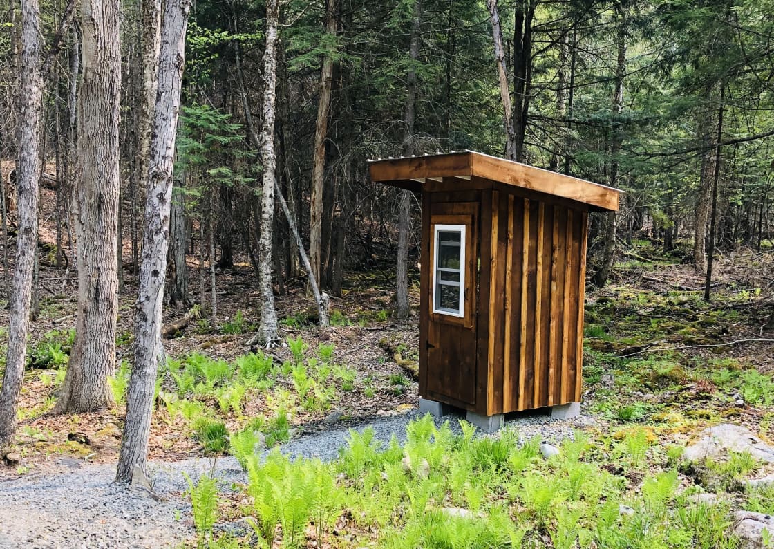 Brand new outhouse out behind tiny cabin