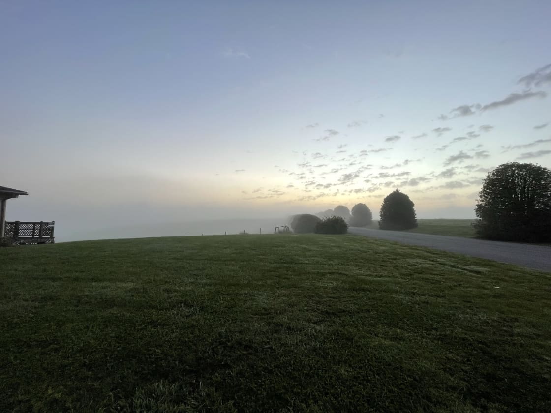 Early morning fog rolls in and clears with a pleasant sunrise. 