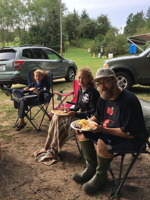 Happy campers at the picnic area near the parking lot
