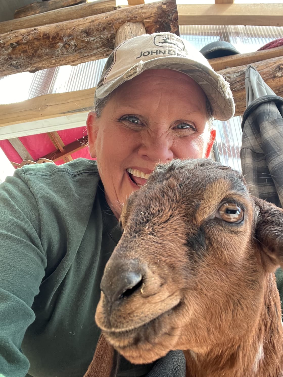 Happy homesteader and goat