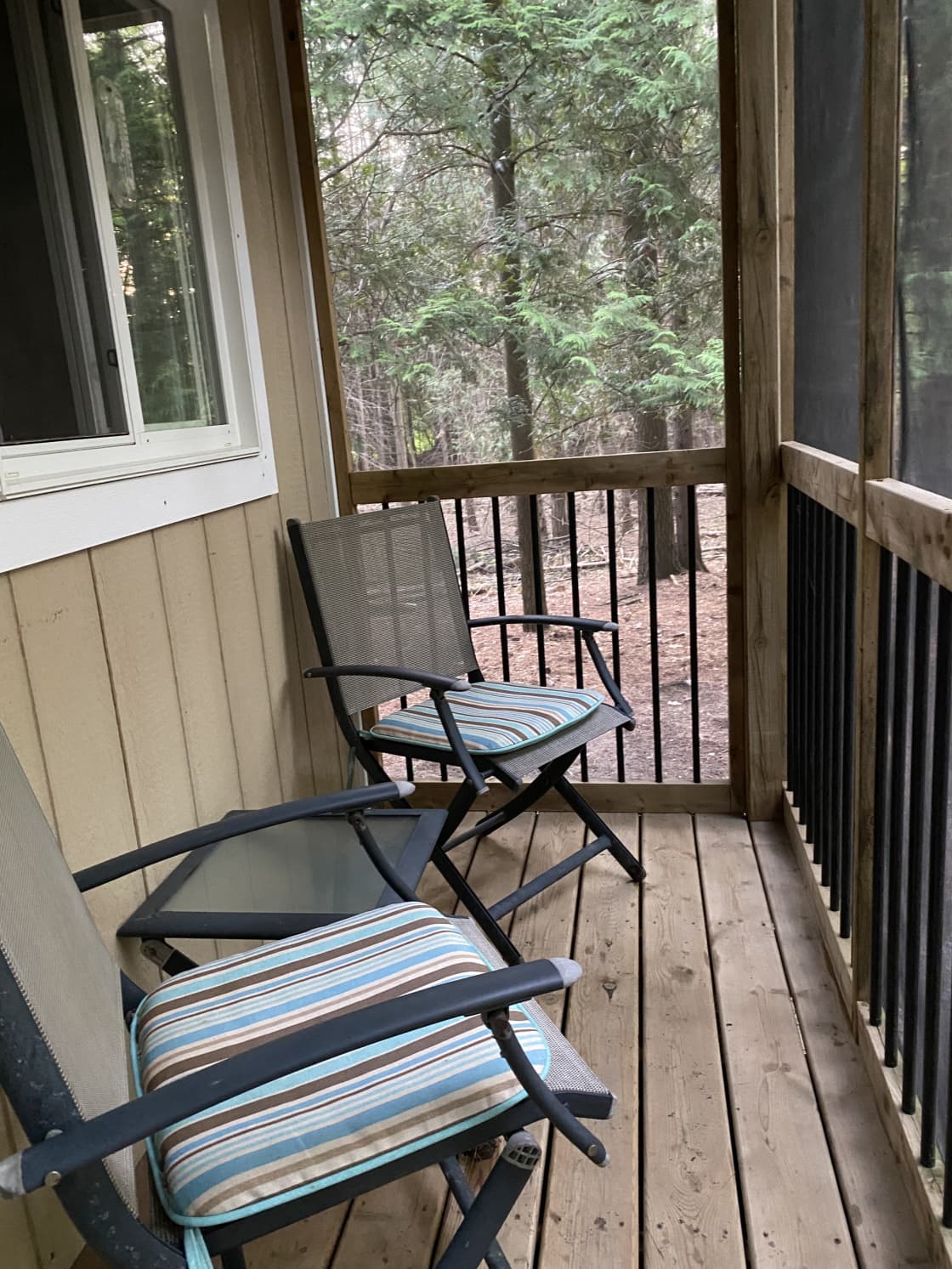 Screened porch and 2 chairs
