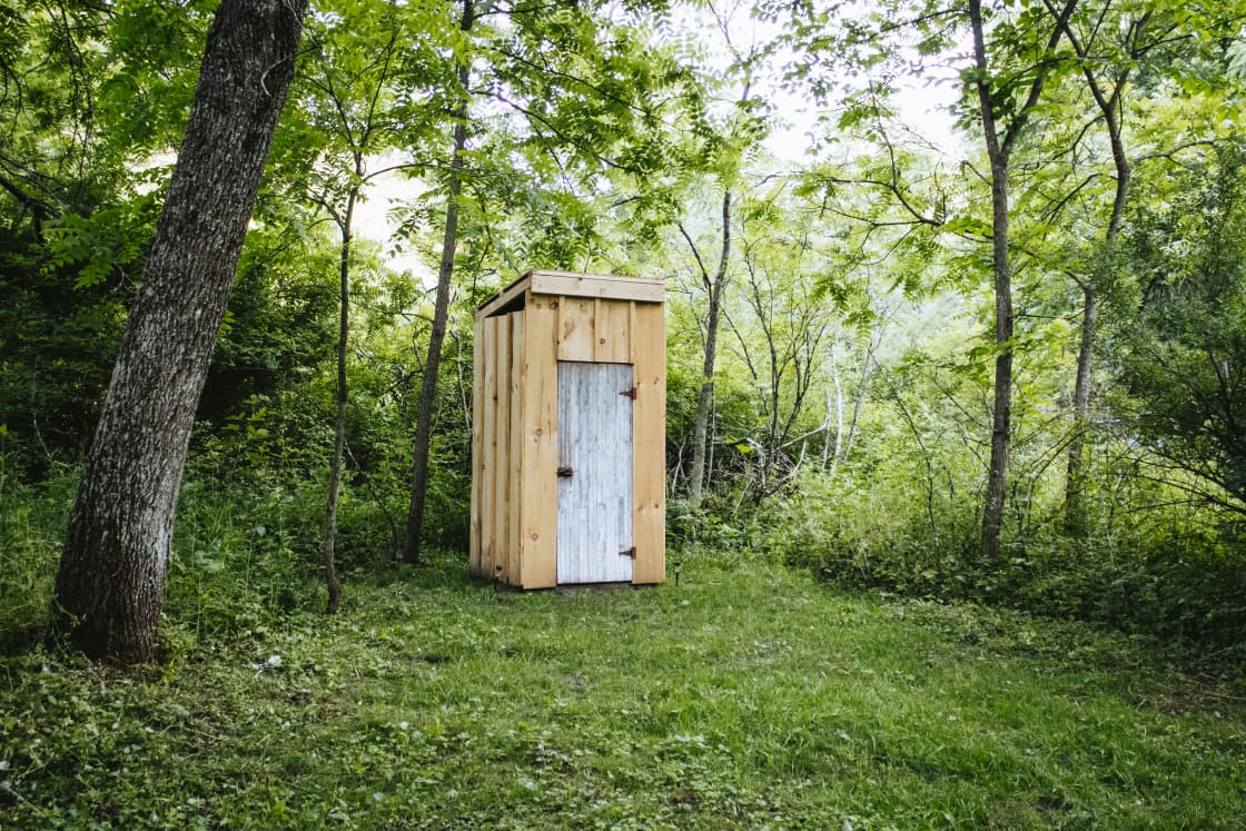 Clean outhouse with lights to help you see once it’s dark 