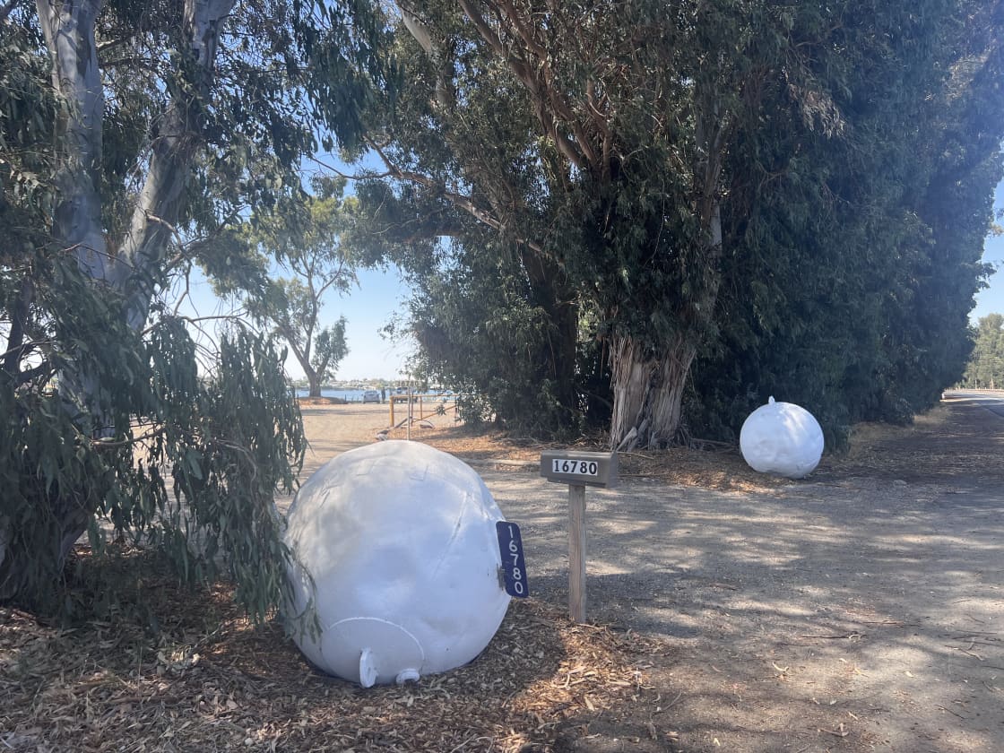 Look for the two big white bouys at site entrance 