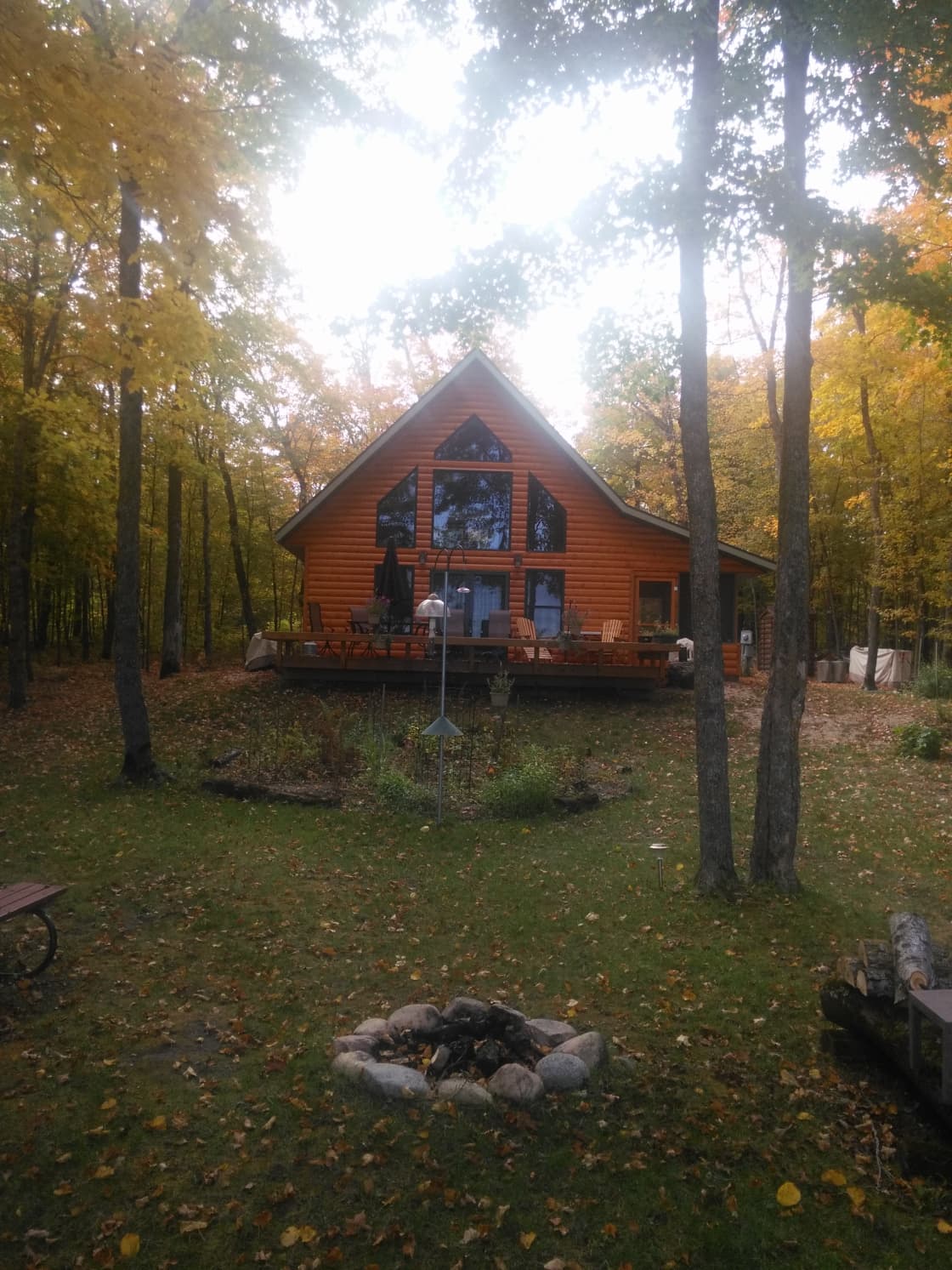 Fall colors surrounding frontside of cabin