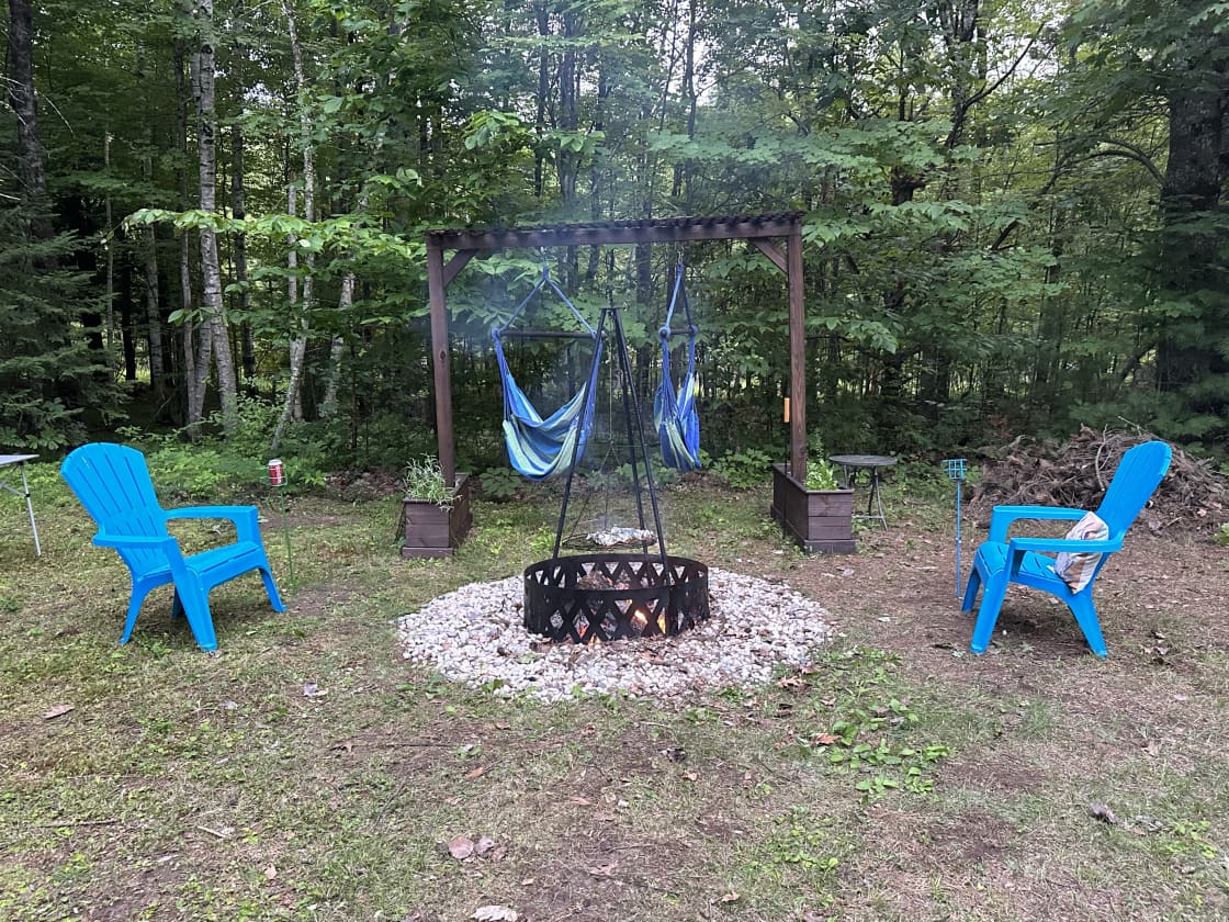 Fire pit with seating and tripod