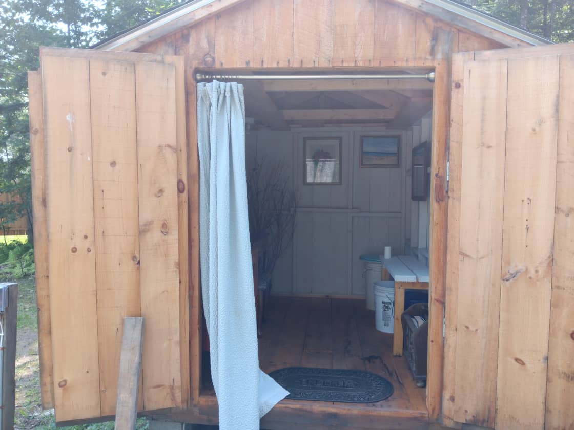 Bathroom shed.  Compost bucket toilet. Compost bags, shavings/moss/leaves provided. 