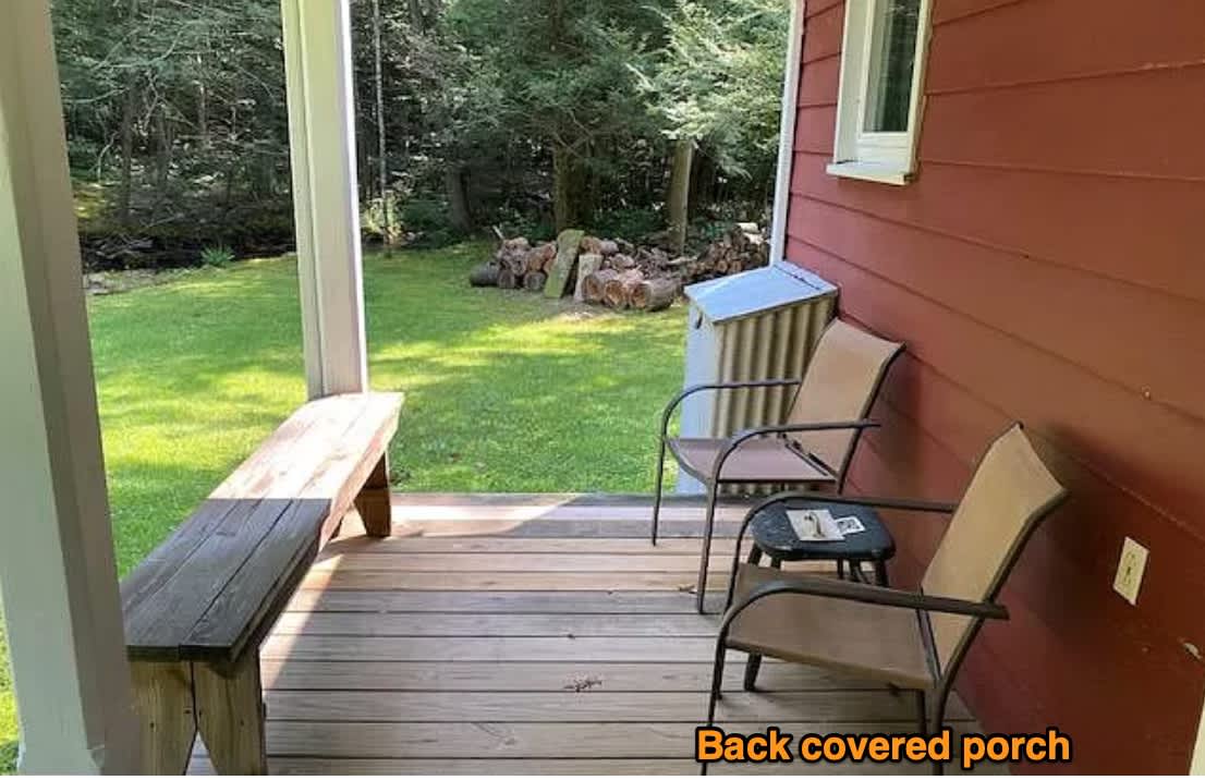 Covered porch with electric and seating. 