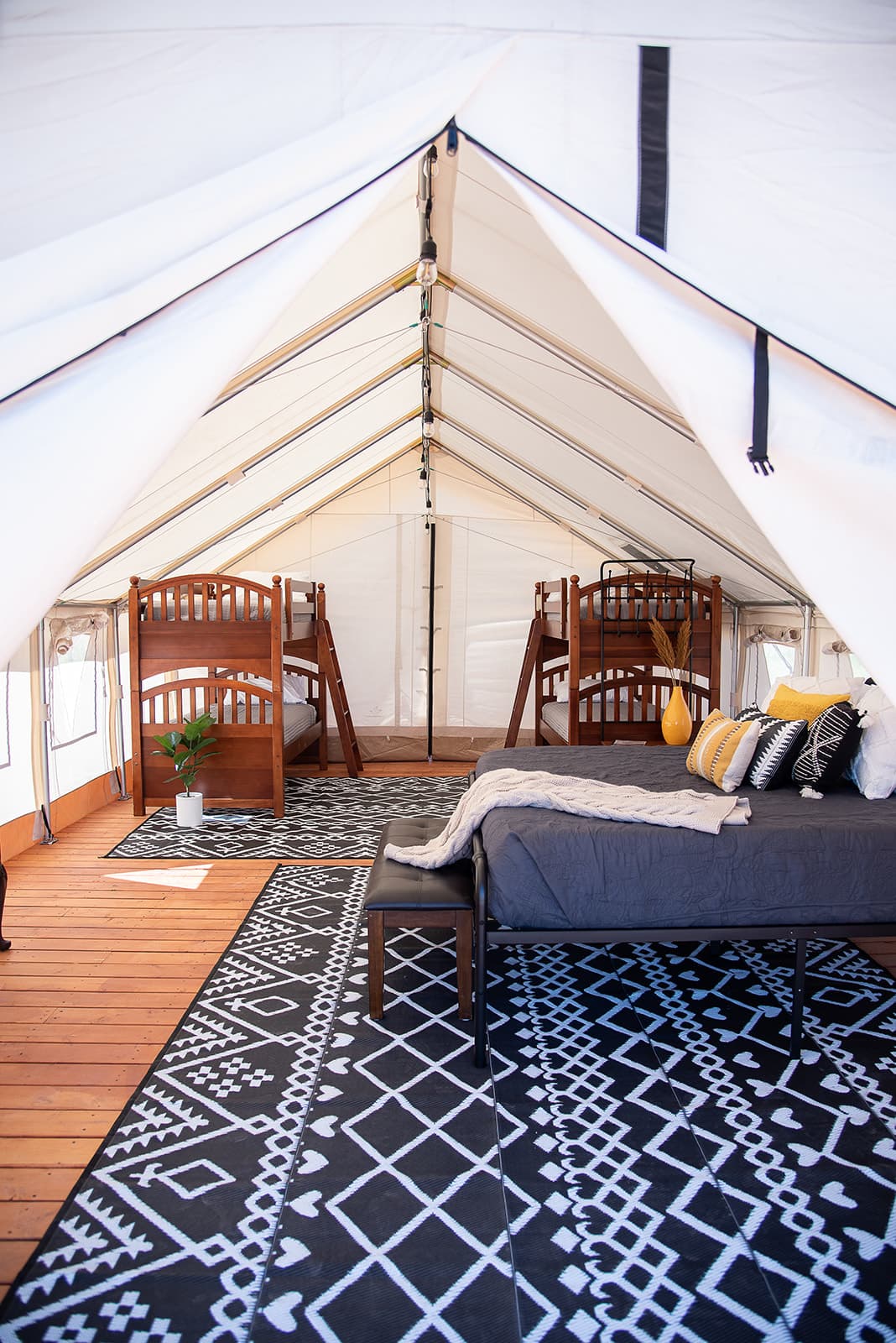 This pictures show the basic layout of the tent with a king size bed and two bunk beds.