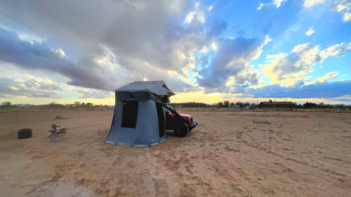 Smittybilt Gen 2 Overlander XL rooftop tent, shown here with annex “lower tent” attached.  *Jeep is not for rent, only rooftop tent*