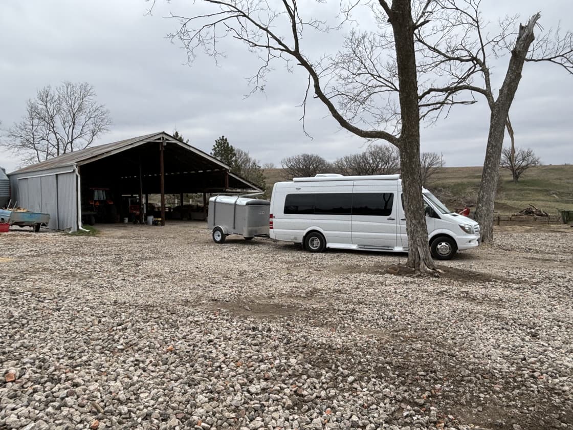 Example of the best spot for parking an RV if expecting rain or snow. This site is the only RV spot with an electrical hook up and a water spigot very close by. Very well lit at night time. The cows are your audience!