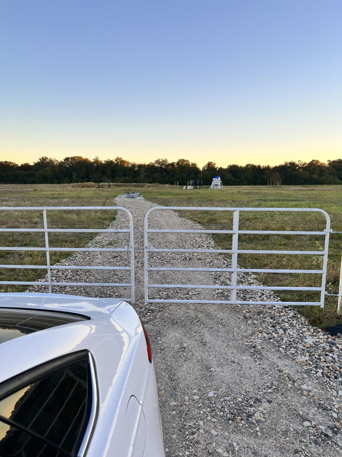 Entrance 1: White Gate with Gravel Road
