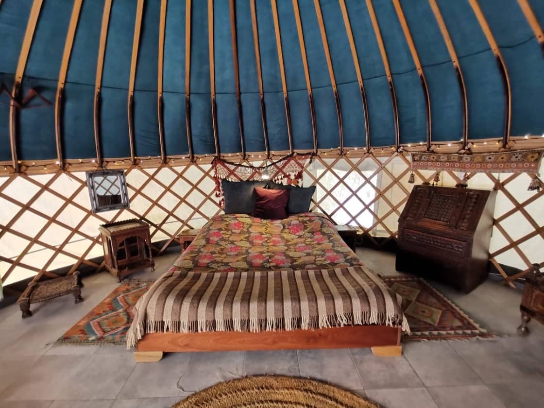 Cosy yurt with comfy double bed, insulated roof and roll up windows.