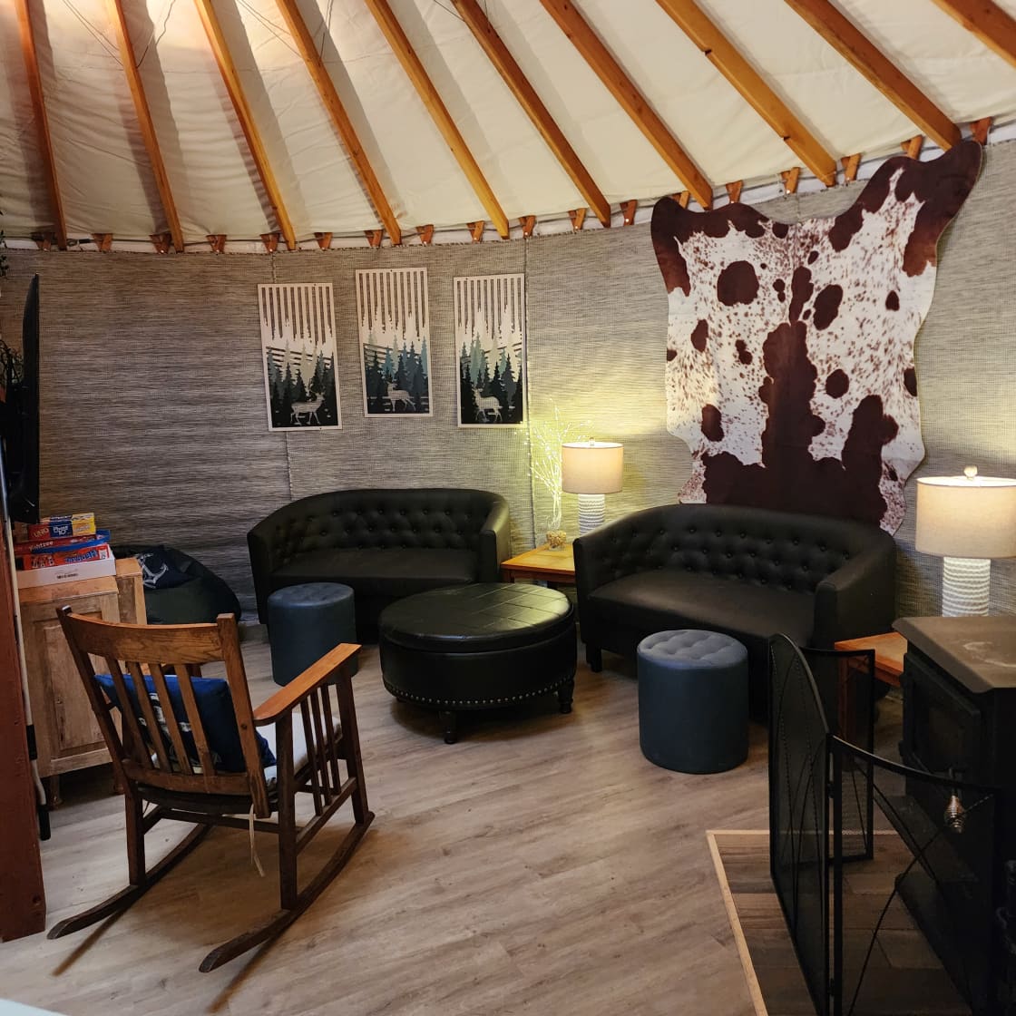 Yurt Livingroom, seats 6. Has a real sturdy rocking chair, two loveseats and a leather bean bag chair. 