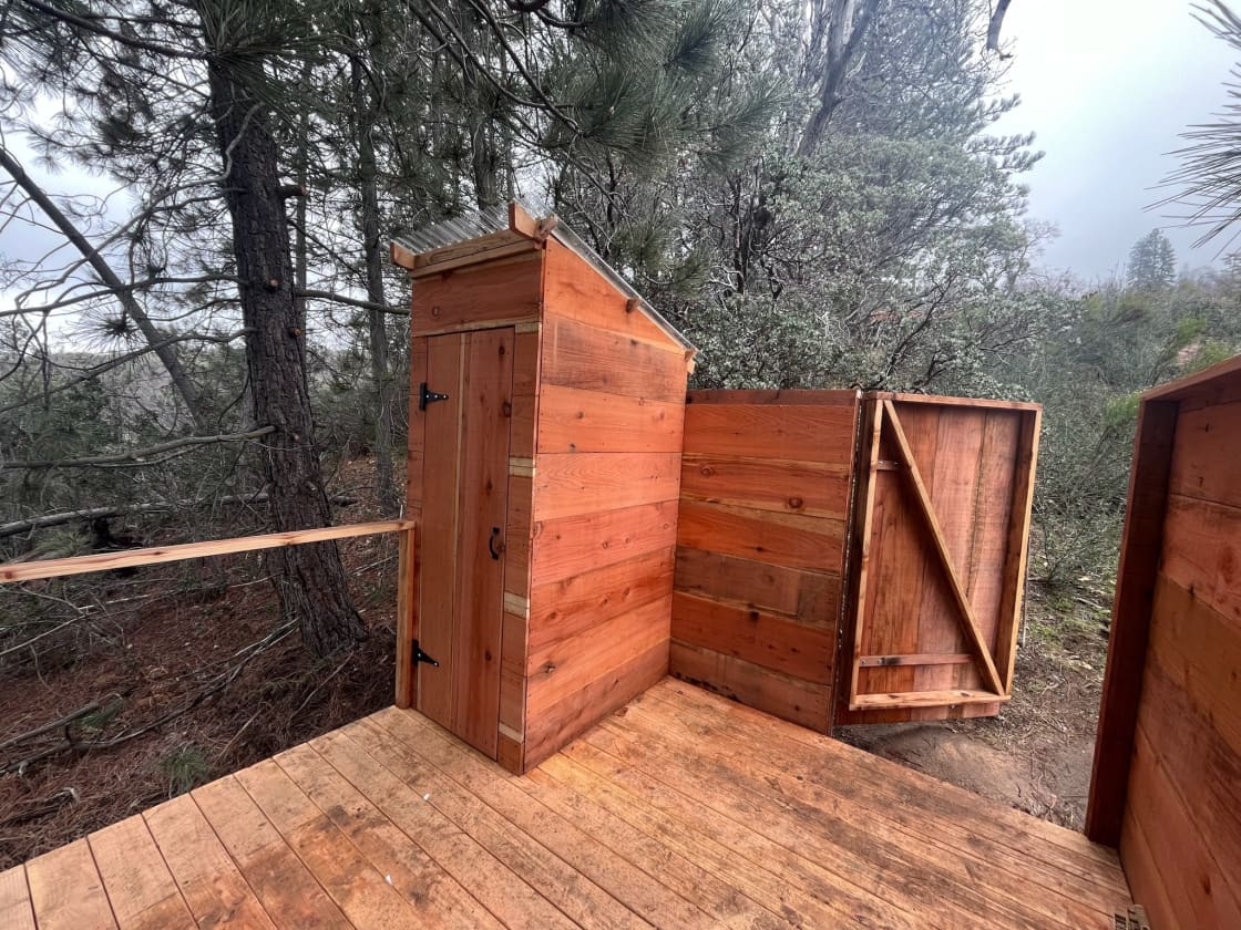 While it is still under construction, once completed, you will have access to your own private deck with an outhouse-style flushing toilet and outdoor shower. Showing beneath a tree is a beautiful experience!