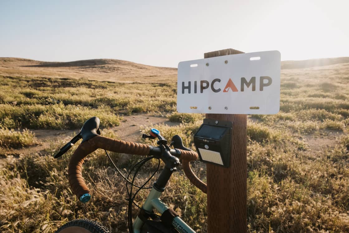 Easily identifiable Hipcamp camping sites thanks to wooden posts with signs and solar lights.
