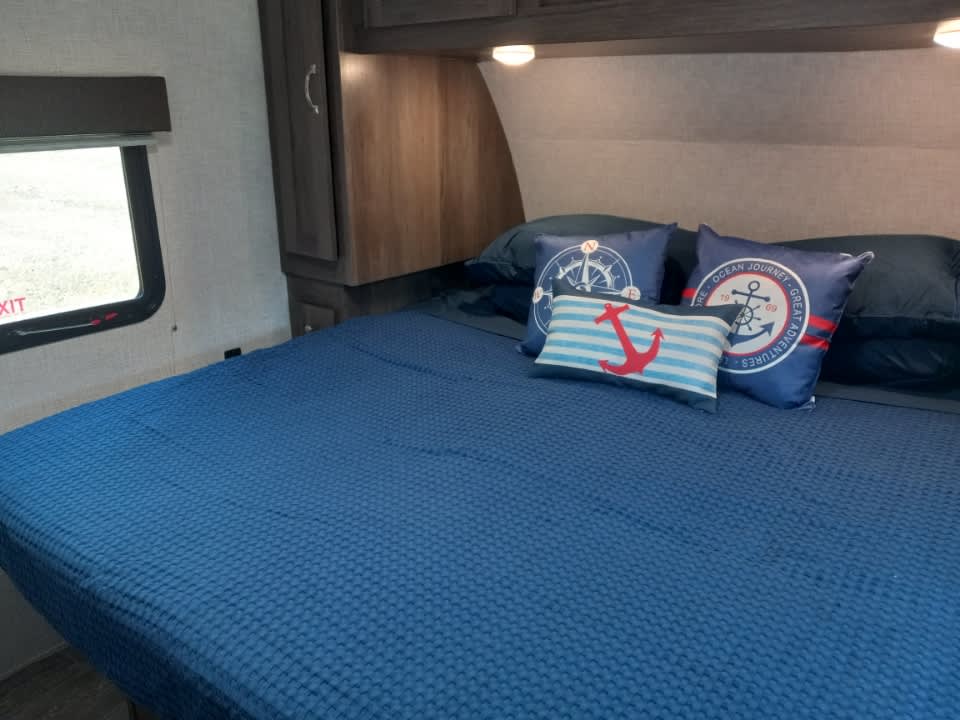 Spacious RV King bed in main private bedroom.