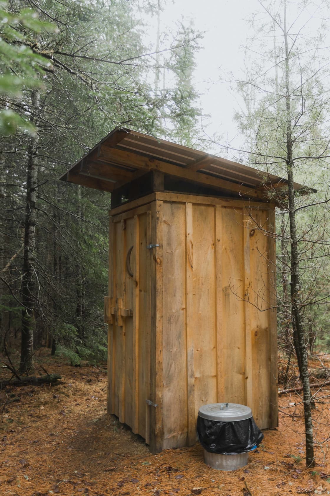 Outhouse with clear instructions inside for use