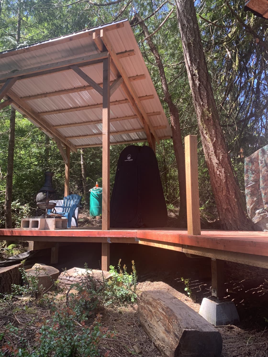 This is the outside deck with the privacy tent for using the camp toilet. 