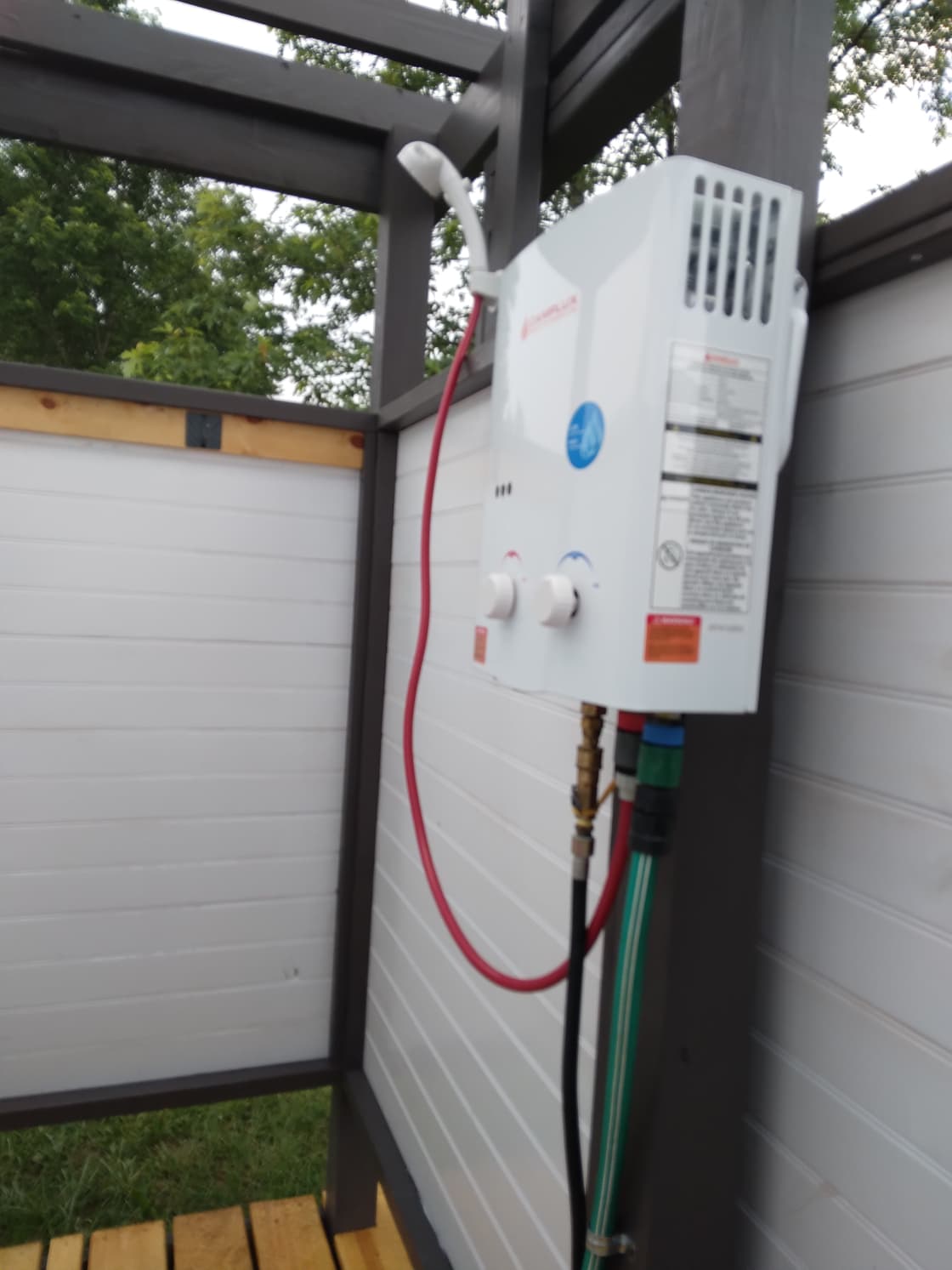 The easy-to-use Camplux on-demand propane water heater is a big hit.  It works great.