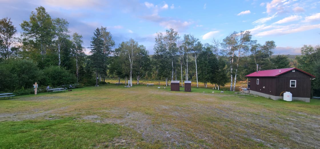 There are 5 RV hookup sites on this lot, along with a rental cabin.  Lot 1 & 2 are on the riverbank.  Lots 3 & 4 are on the tree line on the left.  Lot 5 is right next to the cabin.  