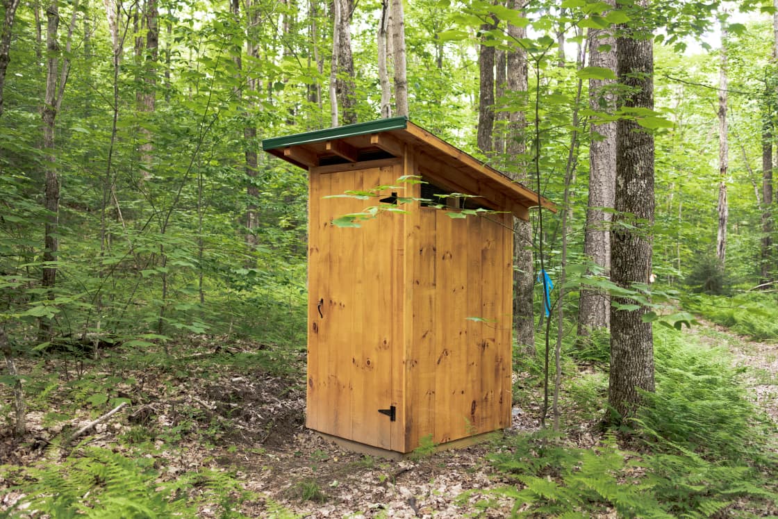 The outhouse is near when you park before you walk the trail to your cabin. 