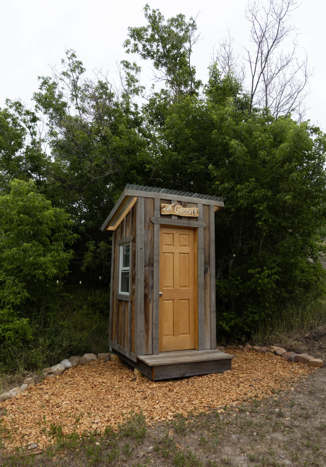 The Groover: a primitive (and very comfortable) composting toilet system following the "Humanure" method. That's right, we compost your poop!