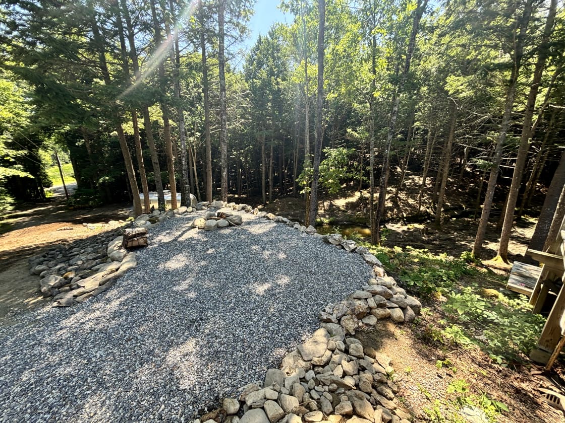 Campsite 1, stream side view on fly dry hilltop with crushed stone for good drainage. Perfect size fire pit and plenty of room to setup your campsite. 