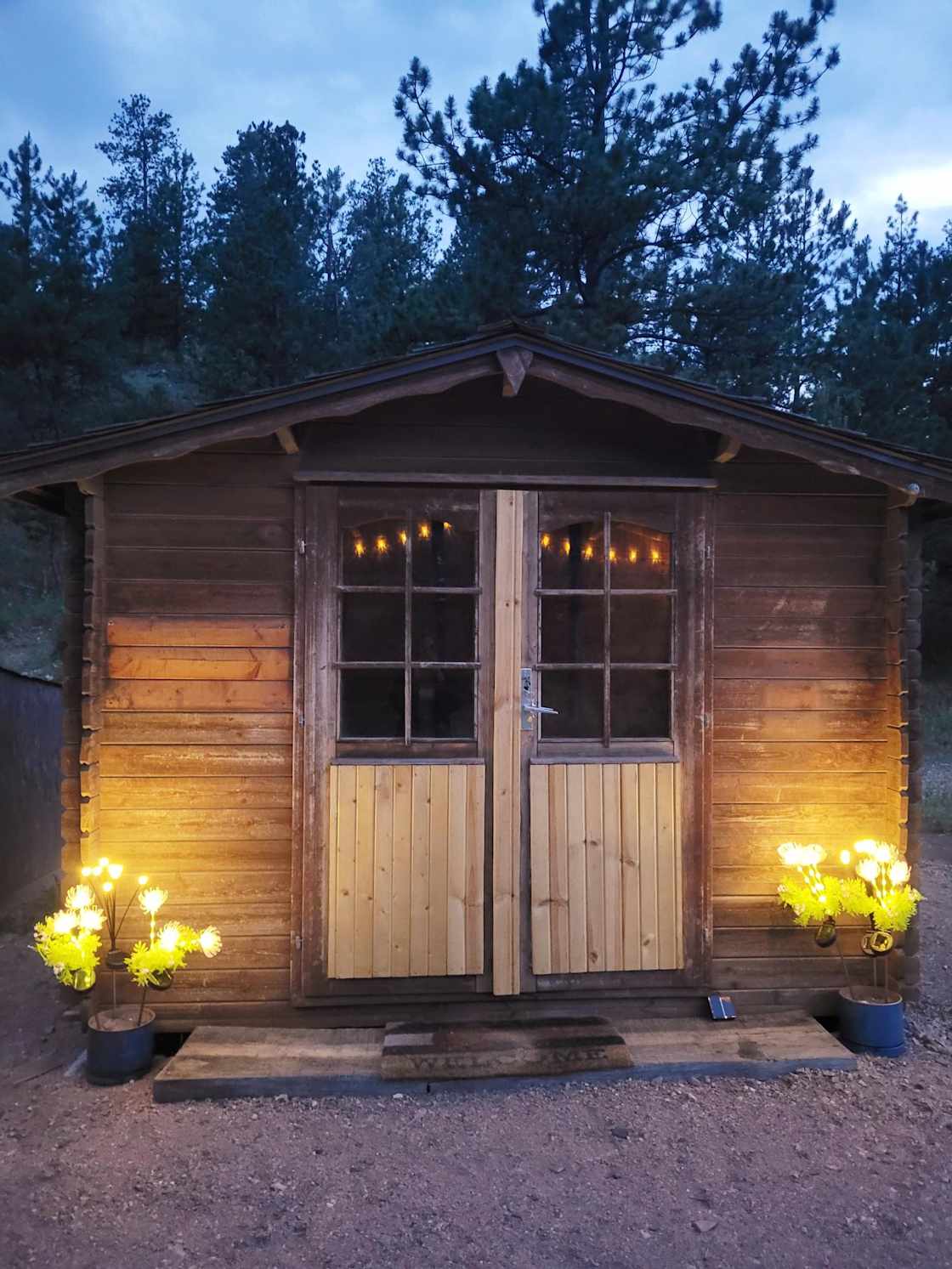 Rustic Cabin. Sleeps 1-2. Includes full bed with bedding.