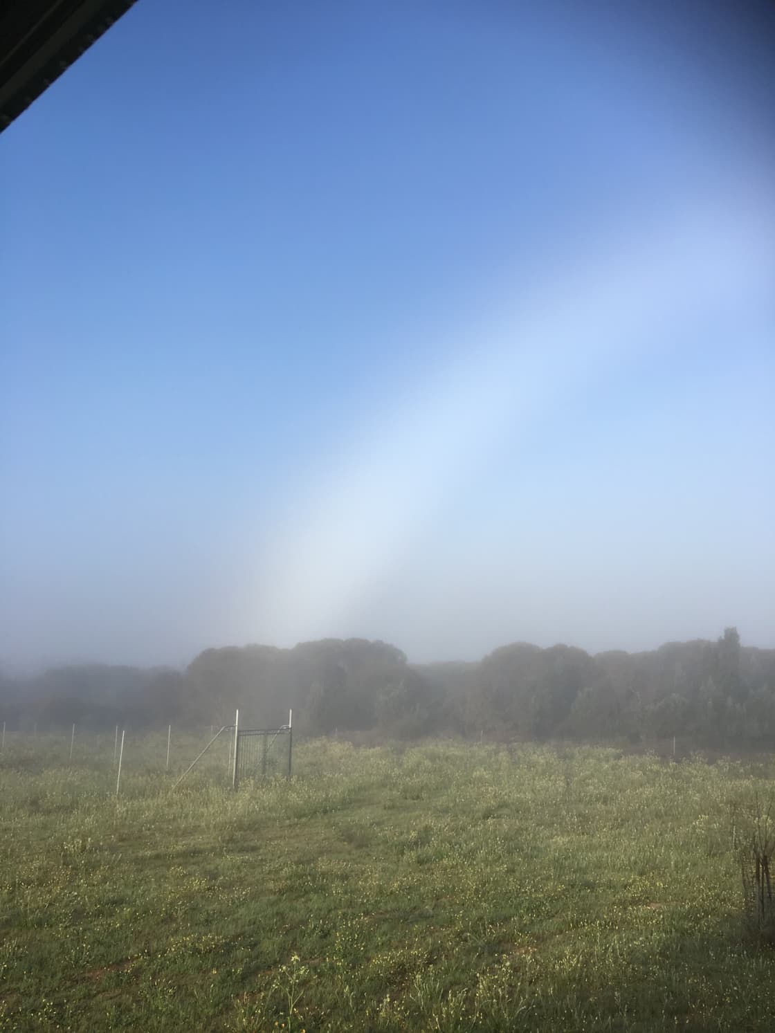 A white rainbow of mist
