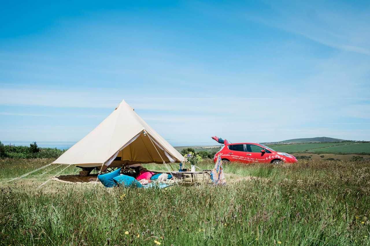 You can roll up the base walls of the bell tents to enjoy the sea breeze.