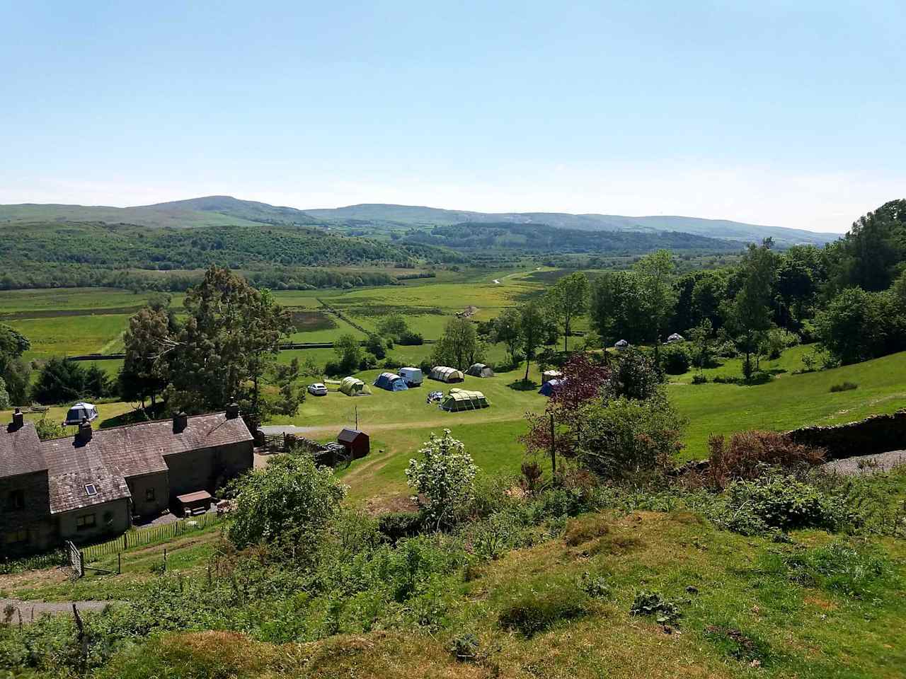 Moss Side Farm Campsite is set on a natural plateau, with flat, grassy tent pitches overlooking Kirkby Pool.