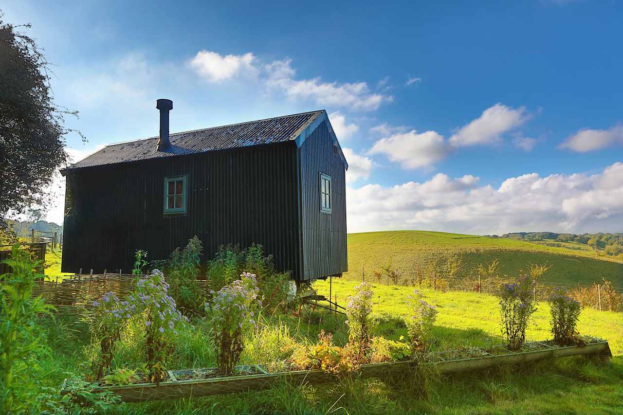 An authentic shepherd's hut in Kent, restored from the 1890s and kitted out for couples with a king-sized bed, wood-burning stove and views over the Kent Downs.