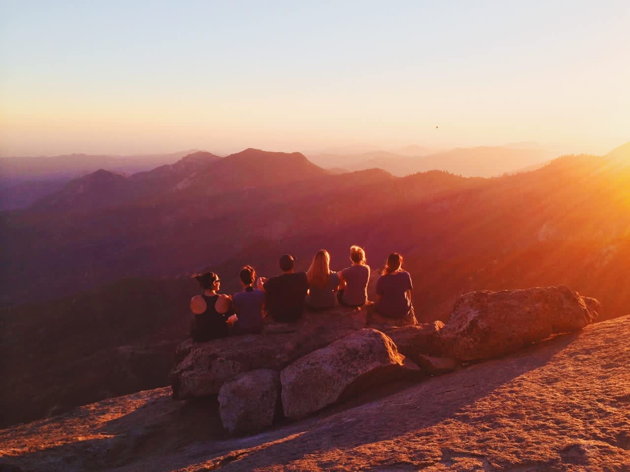 Friends, dark chocolate, and a few bottles of wine. The climb up to the top of Moro is SOOO worth it. (Jump the railing and head due south-west for this hang out spot!)