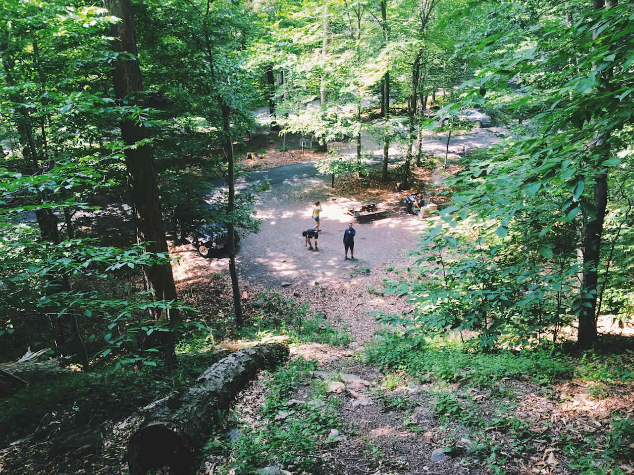 One side of the grounds is steep hills and the other side is a creek. Central spots lack privacy.