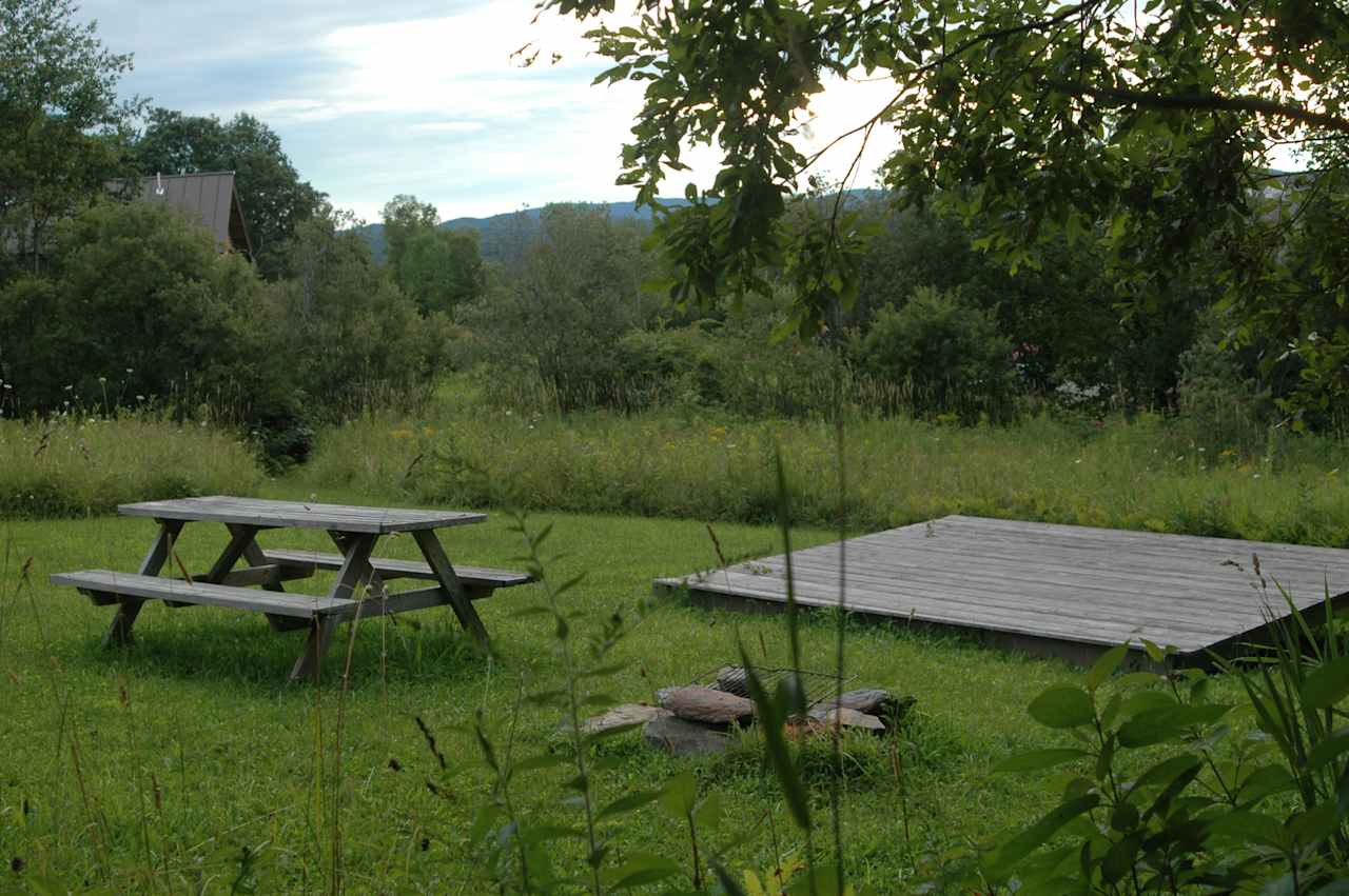 The Wildflower tent site is out in the open with a view of the mountains.