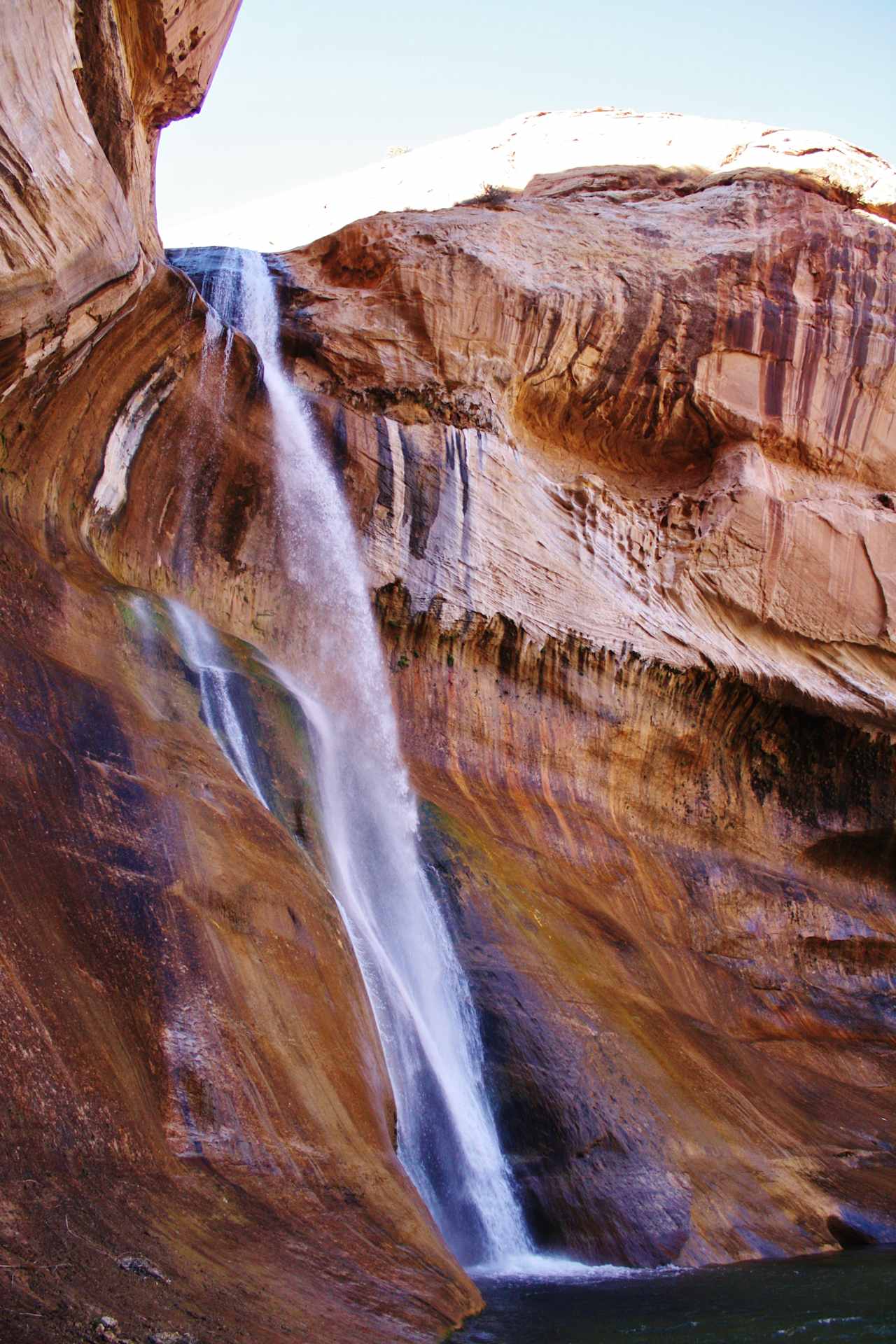 ..after a great walk, through some scrub brush, sand, and over rocky land you reach this very cooling waterfall that just seems surreal.