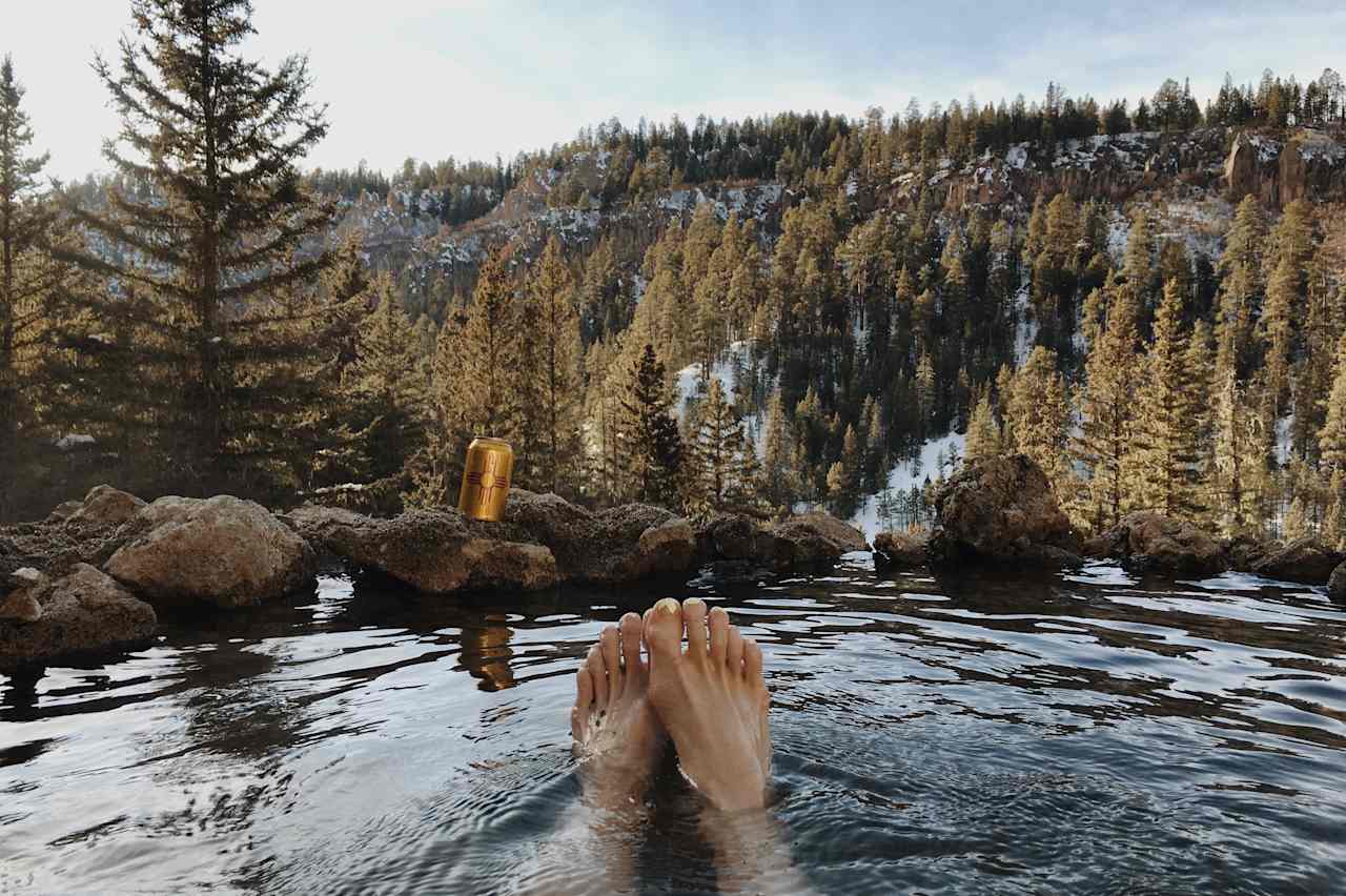 The hot springs cascade down the side of the mountain in a series of private pools overlooking the valley.