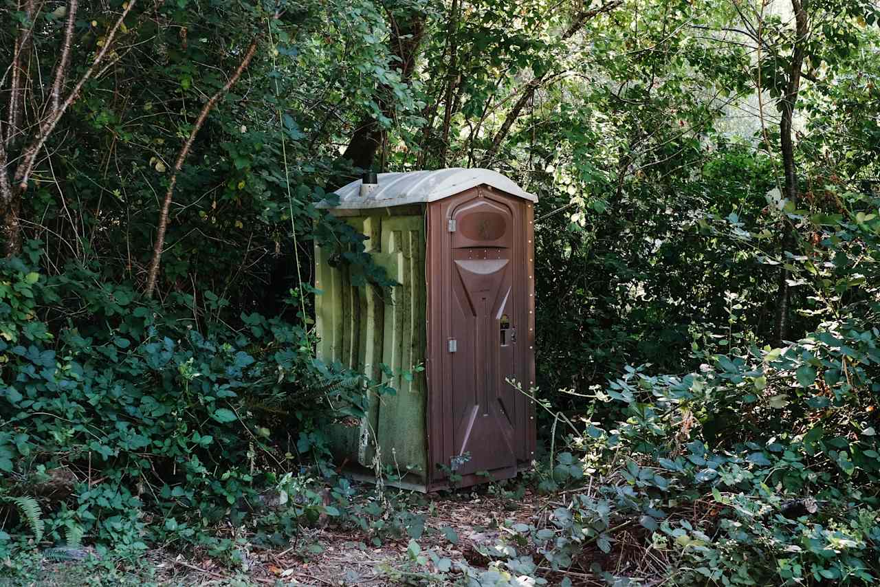 Port-a-loo at the bottom of the hill down to the meadow area.