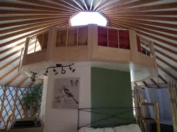 We built an octagon in the middle of the yurt!  It hides the bed, stores the bathroom, and affords 90 more sq. footage while bringing you closer to the stars at night!  Brilliant, and something to experience!